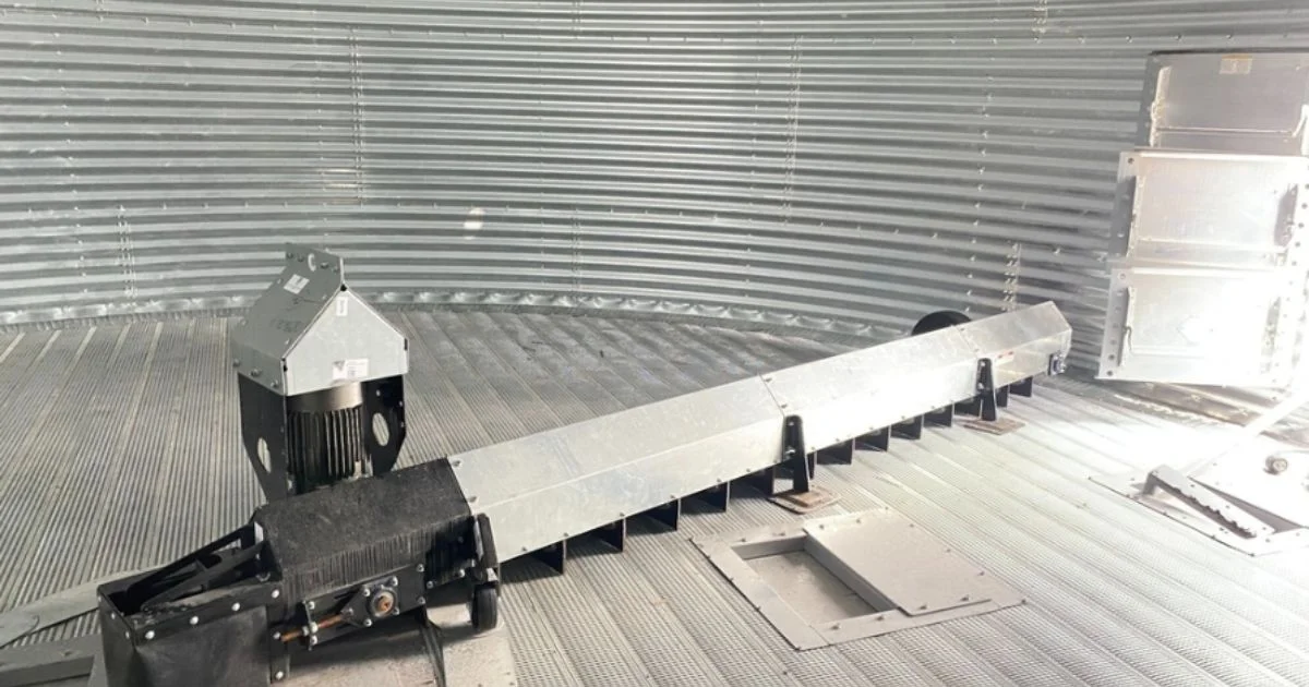 Grain bin sweep auger system inside steel storage bin